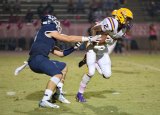 Lemoore's Demel Turner stepped into an interception and returned it for 71 yards to help Lemoore defeat Redwood 21-14 Friday night in Visalia.